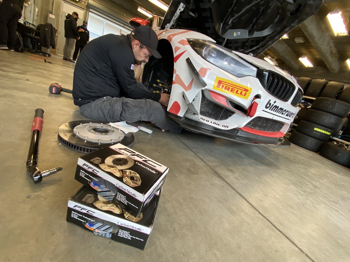 New PFC race pads being installed on the Red Line Oil BMW M4 GT4 at Indy