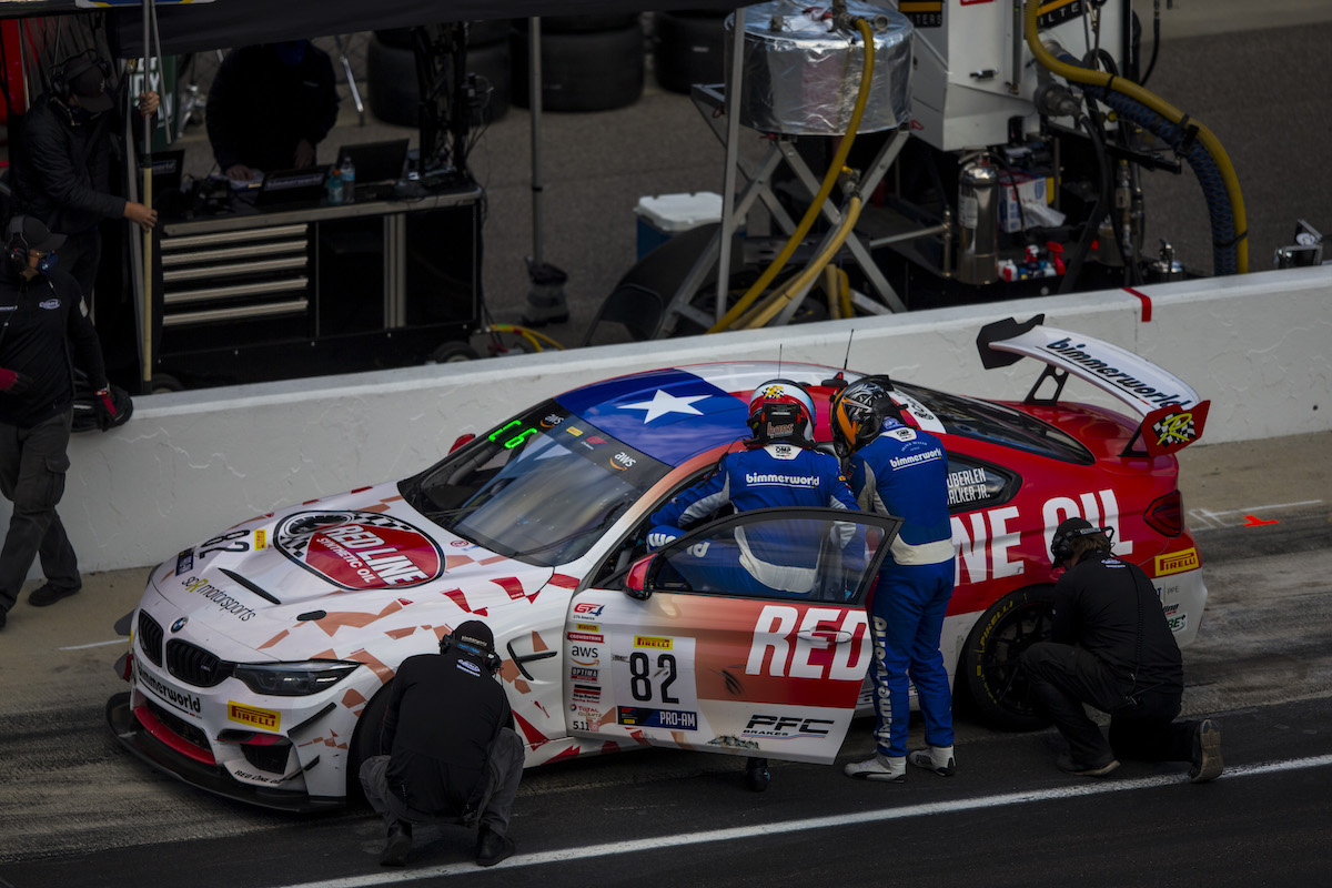 BimmerWorld Red Line Oil M4 GT4 in the pits at Indy