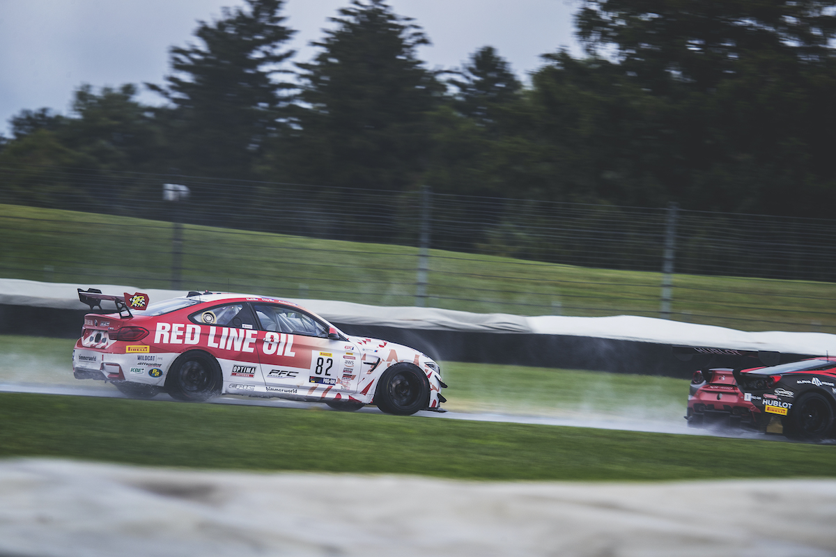 Red Line Oil M4 GT4 racing in the rain at Indy