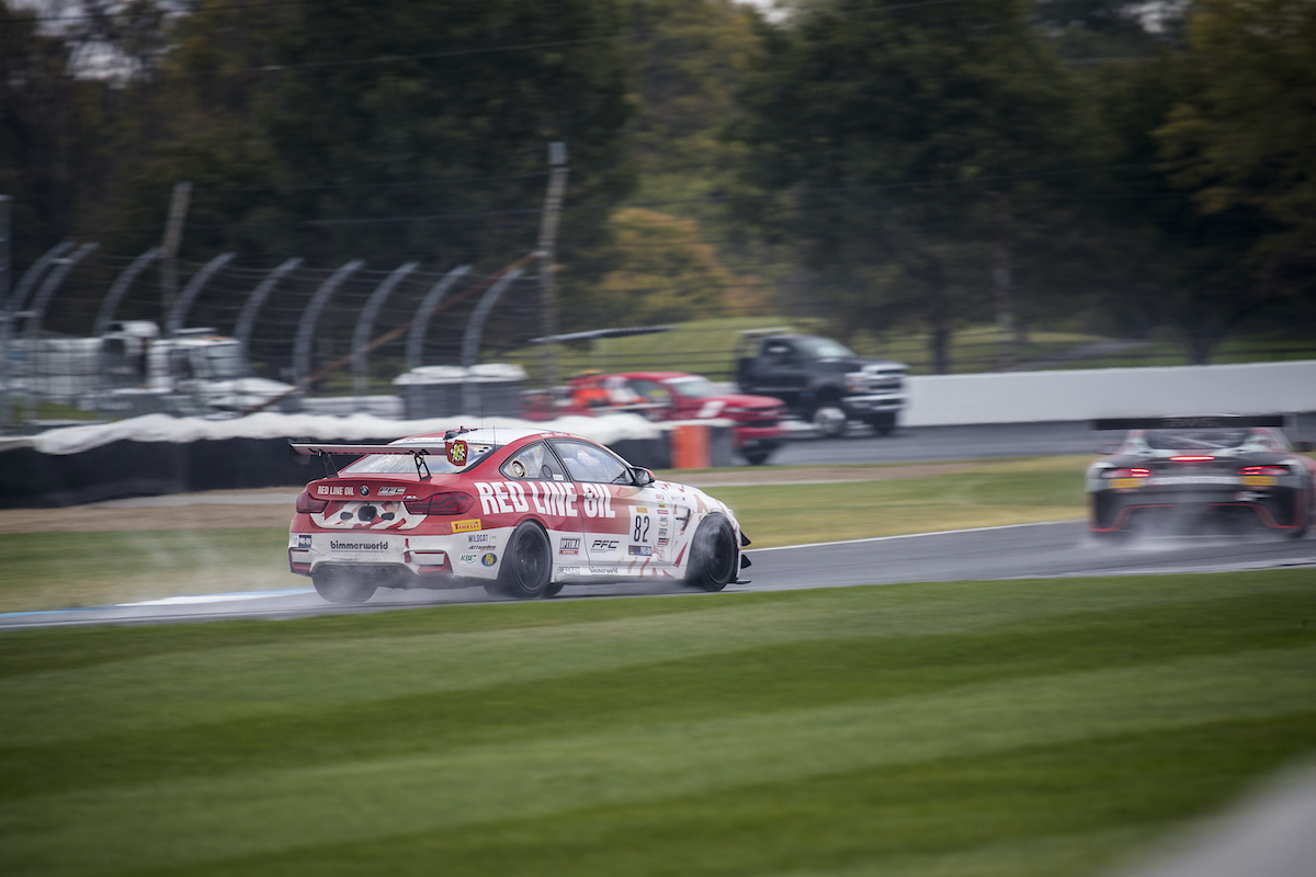 RLO M4 GT4 racing in the rain at Indy