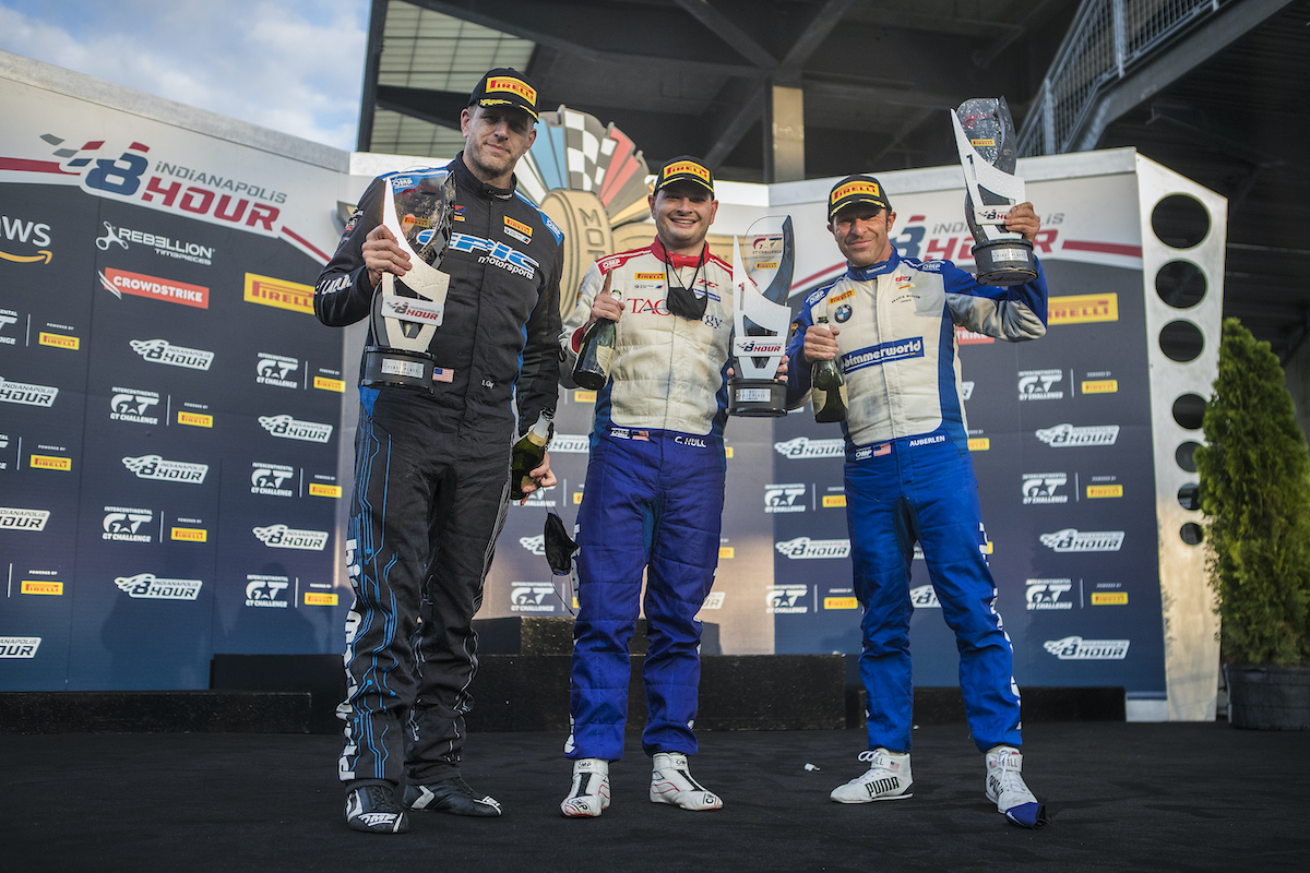 Clay, Walker, Jr., and Auberlen celebrating after winning at Indy