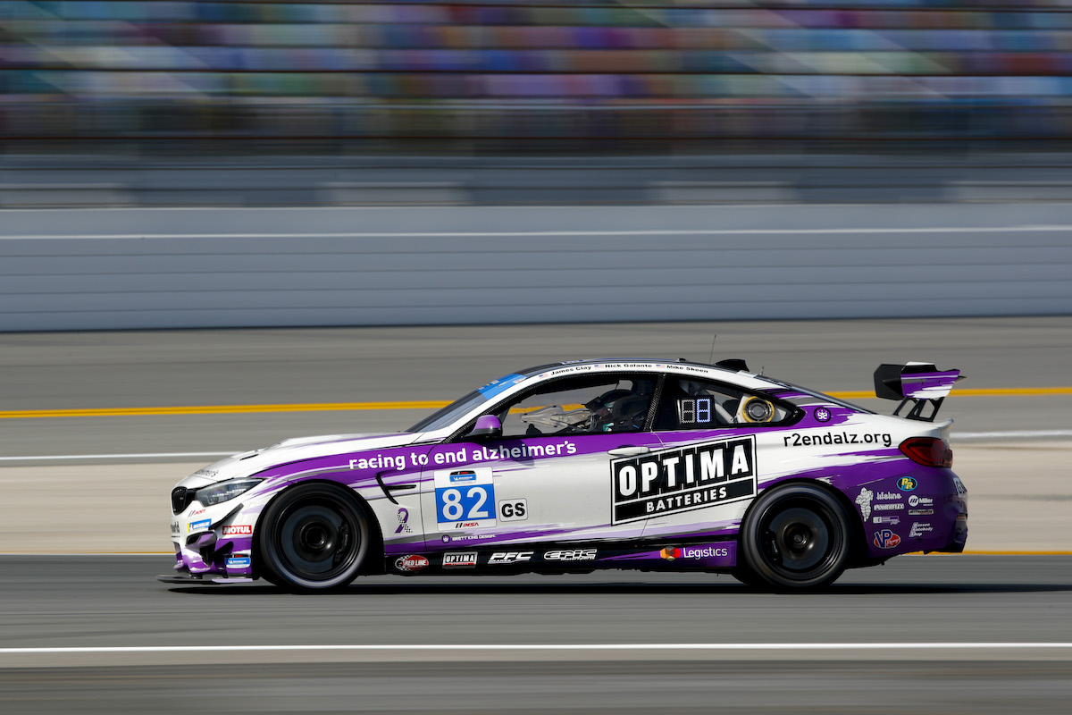 Side profile of BWR M4 GT4 on the infield BimmerWorld Racing - IMSA Michelin Pilot Challenge - Daytona International Speedway