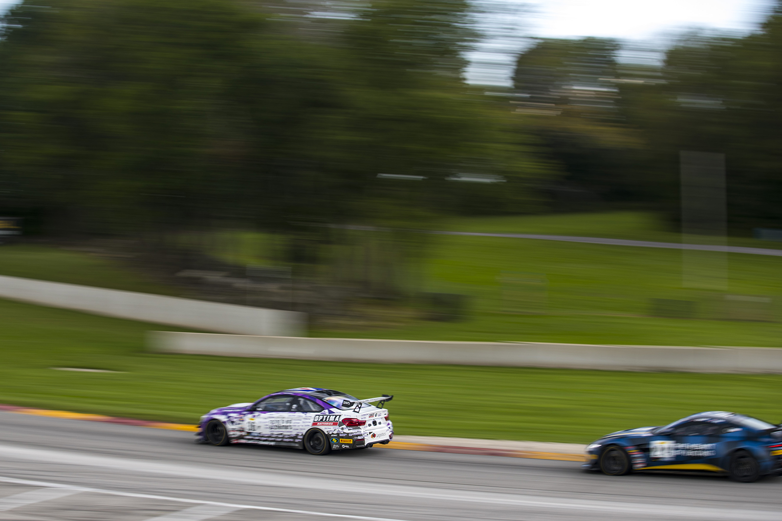 BimmerWorld M4 GT4 at speed at Road America