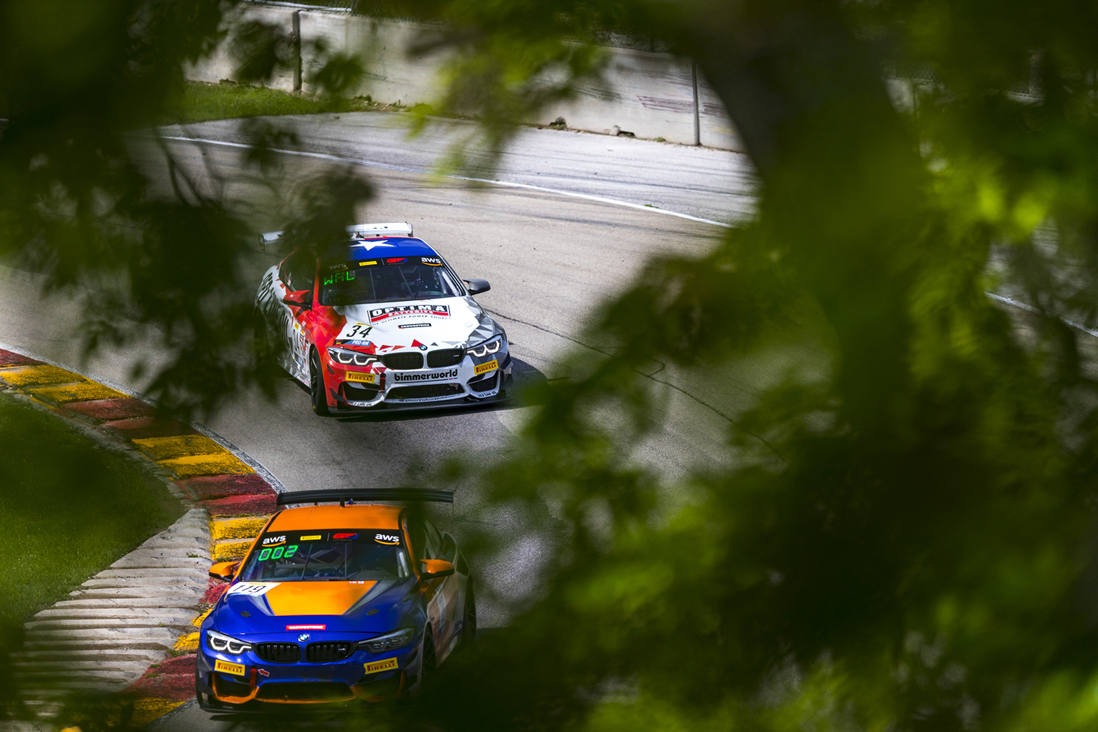 BimmerWorld M4 GT4 chasing another BMW at Road America