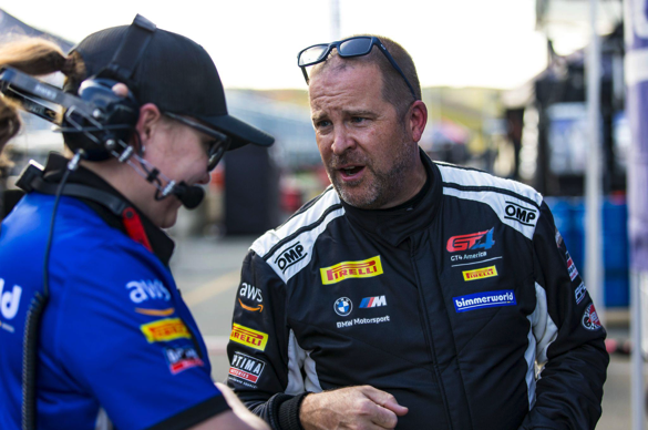 James Walker, Jr. talking to team in pits